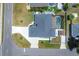 Top-down view of a home with a pool and driveway at 254 Orlando Blvd, Port Charlotte, FL 33954