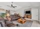 Living room featuring a spacious layout with leather reclining furniture and a large TV at 254 Orlando Blvd, Port Charlotte, FL 33954
