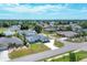 An aerial view of a residential neighborhood, highlighting a single-Gathering home with a flag at 254 Orlando Blvd, Port Charlotte, FL 33954