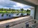 Covered back patio under construction with water view at 2170 Doolittle Ln, Port Charlotte, FL 33953