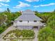 Two-story home with metal roof and beachfront location at 51 Palm Dr, Placida, FL 33946