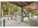 Wooden deck with stairs leading to the house at 51 Palm Dr, Placida, FL 33946