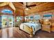 Large main bedroom with hardwood floors and access to a private balcony at 51 Palm Dr, Placida, FL 33946