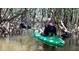 Person kayaking through lush mangrove tunnels at 51 Palm Dr, Placida, FL 33946