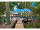 Private dock with boat lifts and paddle boards at 51 Palm Dr, Placida, FL 33946