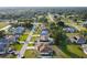 Aerial view of a residential neighborhood showing houses, streets and waterways at 285 Mark Twain Ln, Rotonda West, FL 33947