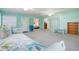 Spacious sunroom with daybed, access to bedroom and backyard at 285 Mark Twain Ln, Rotonda West, FL 33947