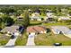 Aerial view of houses in a neighborhood with lush landscaping at 285 Mark Twain Ln, Rotonda West, FL 33947
