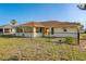 House exterior, rear view, showing a fenced backyard at 285 Mark Twain Ln, Rotonda West, FL 33947
