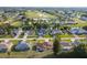 Aerial view of a residential neighborhood with houses, streets, and a golf course at 285 Mark Twain Ln, Rotonda West, FL 33947