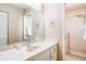 Bright bathroom features a vanity with a sink and a walk-in shower at 285 Mark Twain Ln, Rotonda West, FL 33947