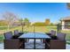 Outdoor patio furniture on a patio overlooking the backyard at 285 Mark Twain Ln, Rotonda West, FL 33947