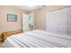 Main bedroom with striped bedding and built-in dresser at 285 Mark Twain Ln, Rotonda West, FL 33947