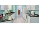 Modern kitchen with white cabinets and granite at 285 Mark Twain Ln, Rotonda West, FL 33947