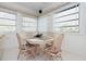 Small dining area with table and four chairs, near a window at 2818 Bourbon St, Englewood, FL 34224