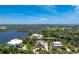 Lovely aerial view capturing the home's charming exterior and waterfront location at 13074 Via Flavia, Placida, FL 33946