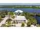 An aerial view of the home and surrounding waterfront area at 13074 Via Flavia, Placida, FL 33946