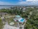 Beautiful aerial view of a waterfront home with a pool and lush landscaping at 13074 Via Flavia, Placida, FL 33946