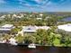 Bird's-eye view showcasing the home's waterfront location and surrounding landscape at 13074 Via Flavia, Placida, FL 33946