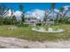 Relaxing backyard with a fire pit and seating area at 13074 Via Flavia, Placida, FL 33946