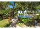 Tranquil backyard oasis with waterfront views and seating area at 13074 Via Flavia, Placida, FL 33946