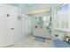 Bathroom with vanity, shower, and coastal-themed decor at 13074 Via Flavia, Placida, FL 33946