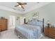 Large main bedroom with private balcony access, ensuite bathroom, and walk-in closet at 13074 Via Flavia, Placida, FL 33946