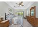 Spacious main bedroom with ceiling fan, sliding glass door to balcony, and ensuite bathroom access at 13074 Via Flavia, Placida, FL 33946