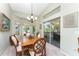 Dining room with water views and access to a balcony at 13074 Via Flavia, Placida, FL 33946