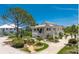 Charming two-story home with landscaped yard and driveway at 13074 Via Flavia, Placida, FL 33946