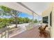 Relaxing front porch with rocking chair and views of the neighborhood at 13074 Via Flavia, Placida, FL 33946