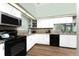 Kitchen equipped with stainless steel appliances and granite countertops with a view to the dining area at 13074 Via Flavia, Placida, FL 33946
