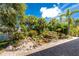 Tropical landscaping with rock water feature and paver patio at 13074 Via Flavia, Placida, FL 33946