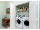 Laundry room with LG washer and dryer, storage shelves, and folding area at 13074 Via Flavia, Placida, FL 33946