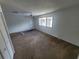 Spacious bedroom with a large window and ceiling fan at 22481 Westchester Blvd # B35, Punta Gorda, FL 33980