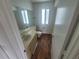 Clean bathroom with wood-look flooring, toilet, and sink at 22481 Westchester Blvd # B35, Punta Gorda, FL 33980