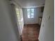 Hallway with wood flooring and access to patio at 22481 Westchester Blvd # B35, Punta Gorda, FL 33980