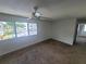 Bright bedroom with large window and ceiling fan at 22481 Westchester Blvd # B35, Punta Gorda, FL 33980