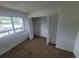 Bedroom with large window and closet at 22481 Westchester Blvd # B35, Punta Gorda, FL 33980