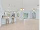 Open living space with high ceilings and kitchen view at 13034 Marathon Blvd, Port Charlotte, FL 33981