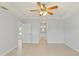 Spacious main bedroom with tile floors and access to bathroom at 13034 Marathon Blvd, Port Charlotte, FL 33981