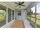 Outdoor patio with screened enclosure and ceiling fan at 13034 Marathon Blvd, Port Charlotte, FL 33981
