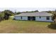 Single-story home with screened patio and yard at 13034 Marathon Blvd, Port Charlotte, FL 33981