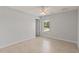 Bright bedroom with tile floors and a window at 13034 Marathon Blvd, Port Charlotte, FL 33981