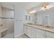 Bathroom with a walk-in shower and double vanity at 13034 Marathon Blvd, Port Charlotte, FL 33981