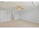 Spacious bedroom with tile flooring and ceiling fan at 13034 Marathon Blvd, Port Charlotte, FL 33981