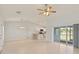 Spacious living room with tile floors and sliding glass doors at 13034 Marathon Blvd, Port Charlotte, FL 33981