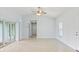 Spacious living area with tile floors and access to a patio at 13034 Marathon Blvd, Port Charlotte, FL 33981