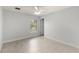 Simple bedroom with tile floors and ceiling fan at 13034 Marathon Blvd, Port Charlotte, FL 33981