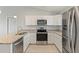 Modern kitchen with stainless steel appliances and granite countertops at 13034 Marathon Blvd, Port Charlotte, FL 33981